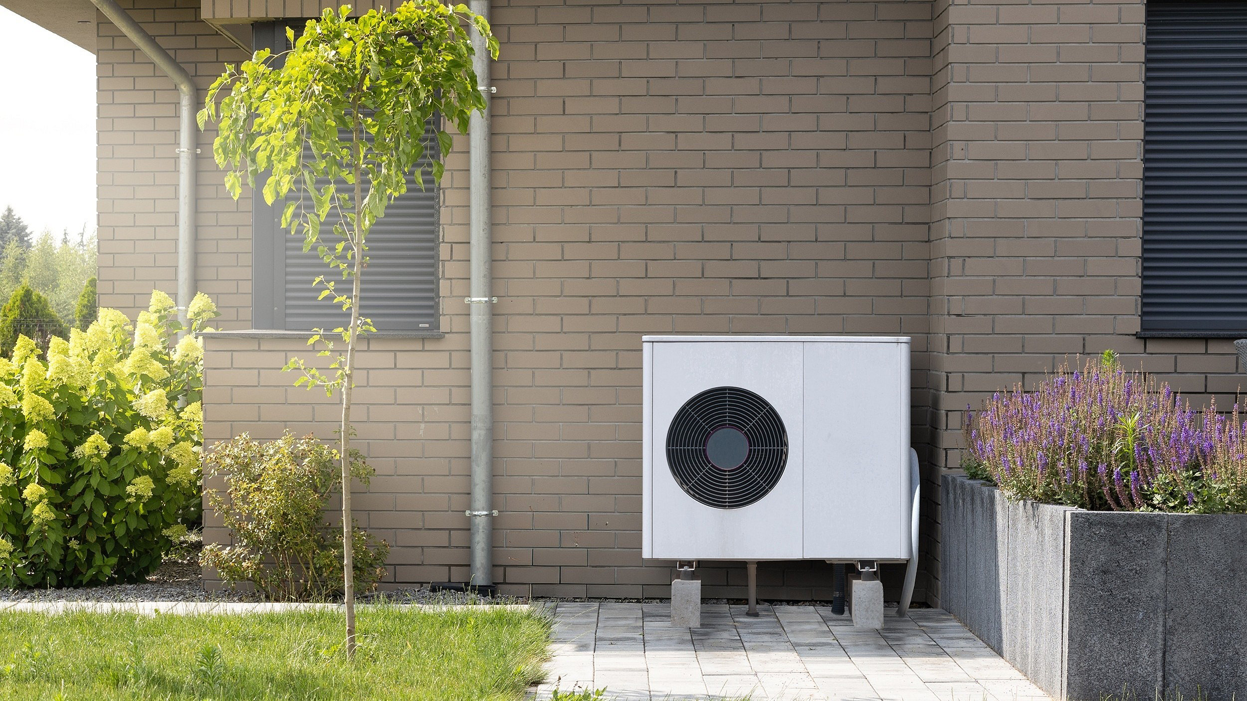 Installation of a domestic air heat pump to the outside of a new building