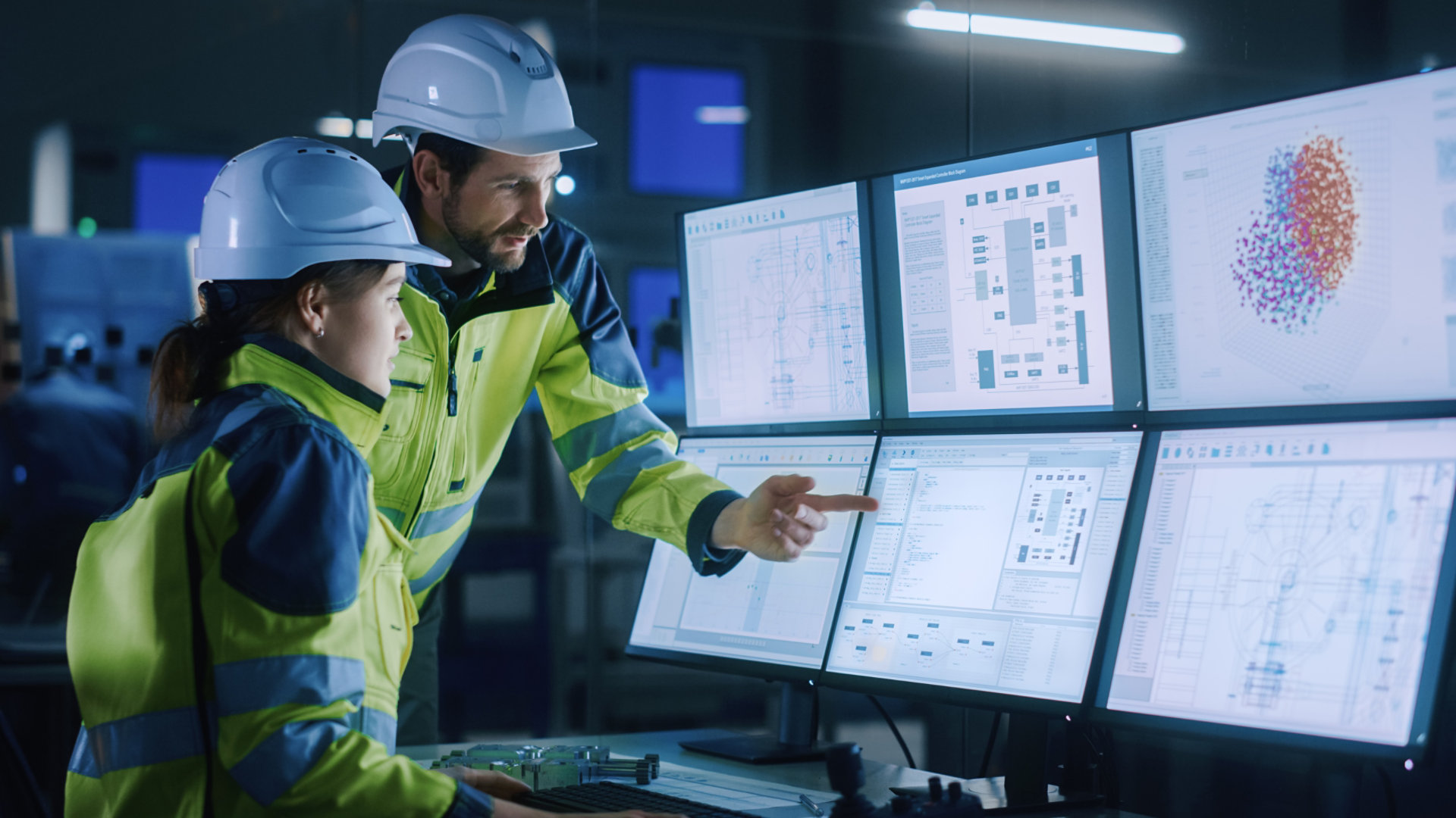 Construction workers looking at computer