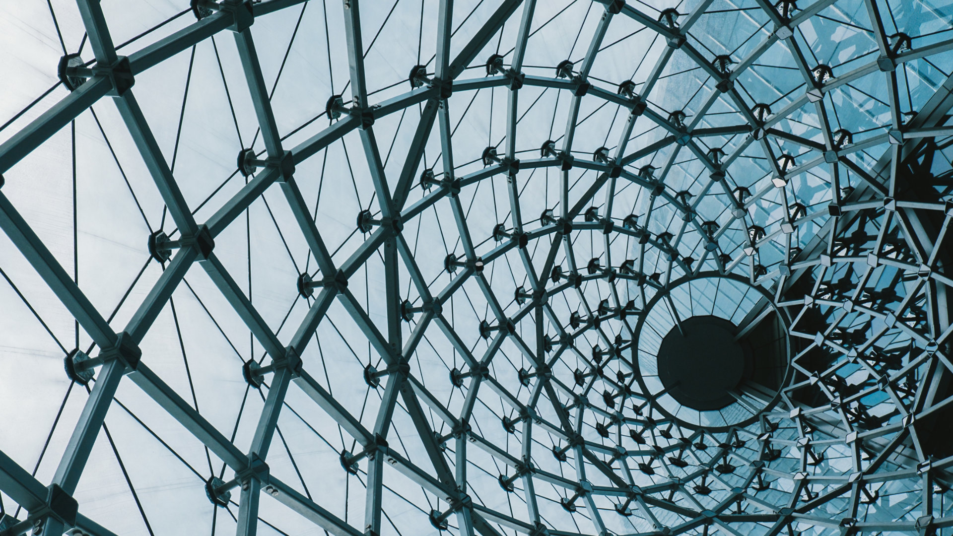 Structural glass facade curving roof of fantastic office building. Modern and Contemporary architectural fiction with glass steel column.Abstract architecture fragment.; Shutterstock ID 505608061; purchase_order: -; job: -; client: -; other: -