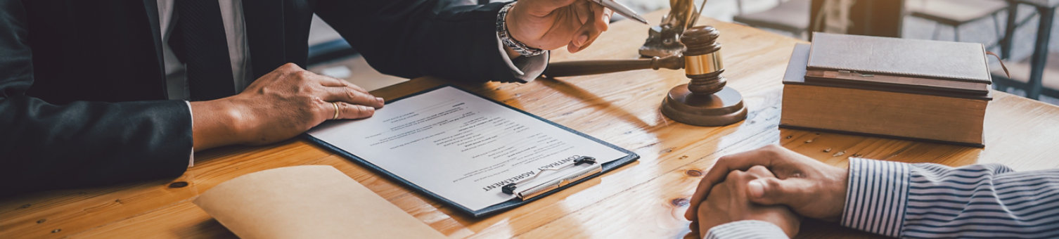 Close-up of a judge with a hammer against the background of professional lawyer talking about a lawsuit. professional lawyers discussing legal case.; Shutterstock ID 2178052061; purchase_order: N/A; job: RICS DRS Image Update Feb25; client: RICS_PP; other: 