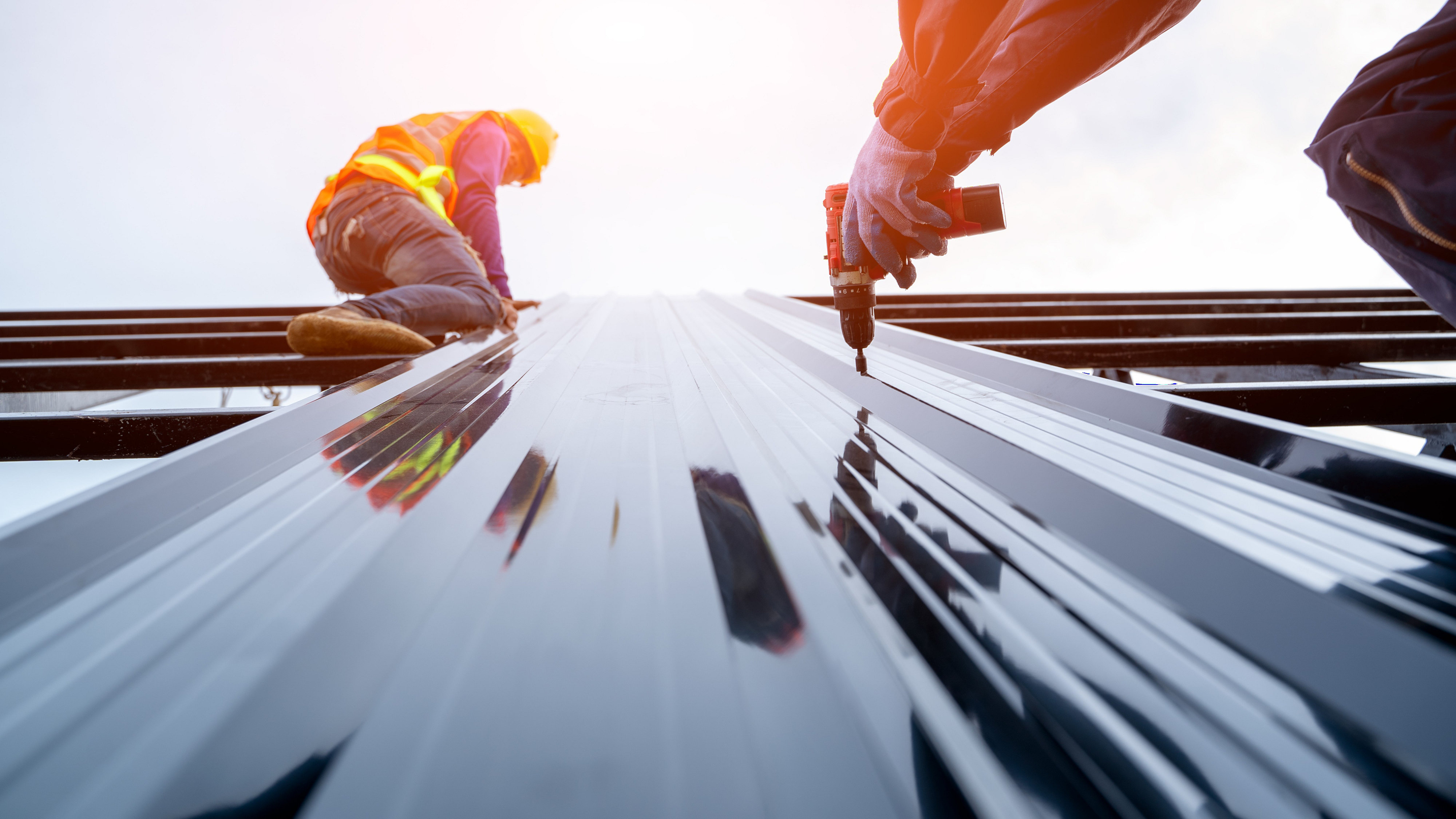 Two men working on rooftop