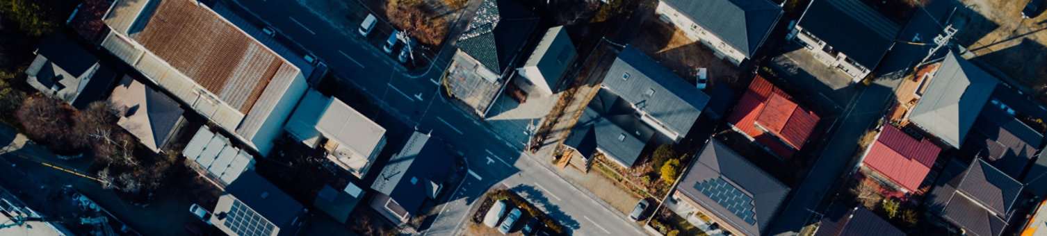 aerial view showing built environment with houses, flats, offices, roads
