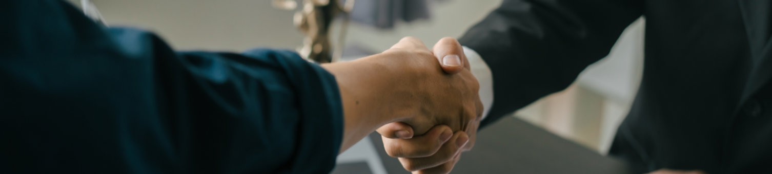 Shaking hands, Lawyers and legal requirements and bribery in adjudicating and adjudicating litigation cases.; Shutterstock ID 2278948571; purchase_order: N/A; job: RICS Mediation, Expert Witness & DRS Imagery; client: RICS_PP; other: 