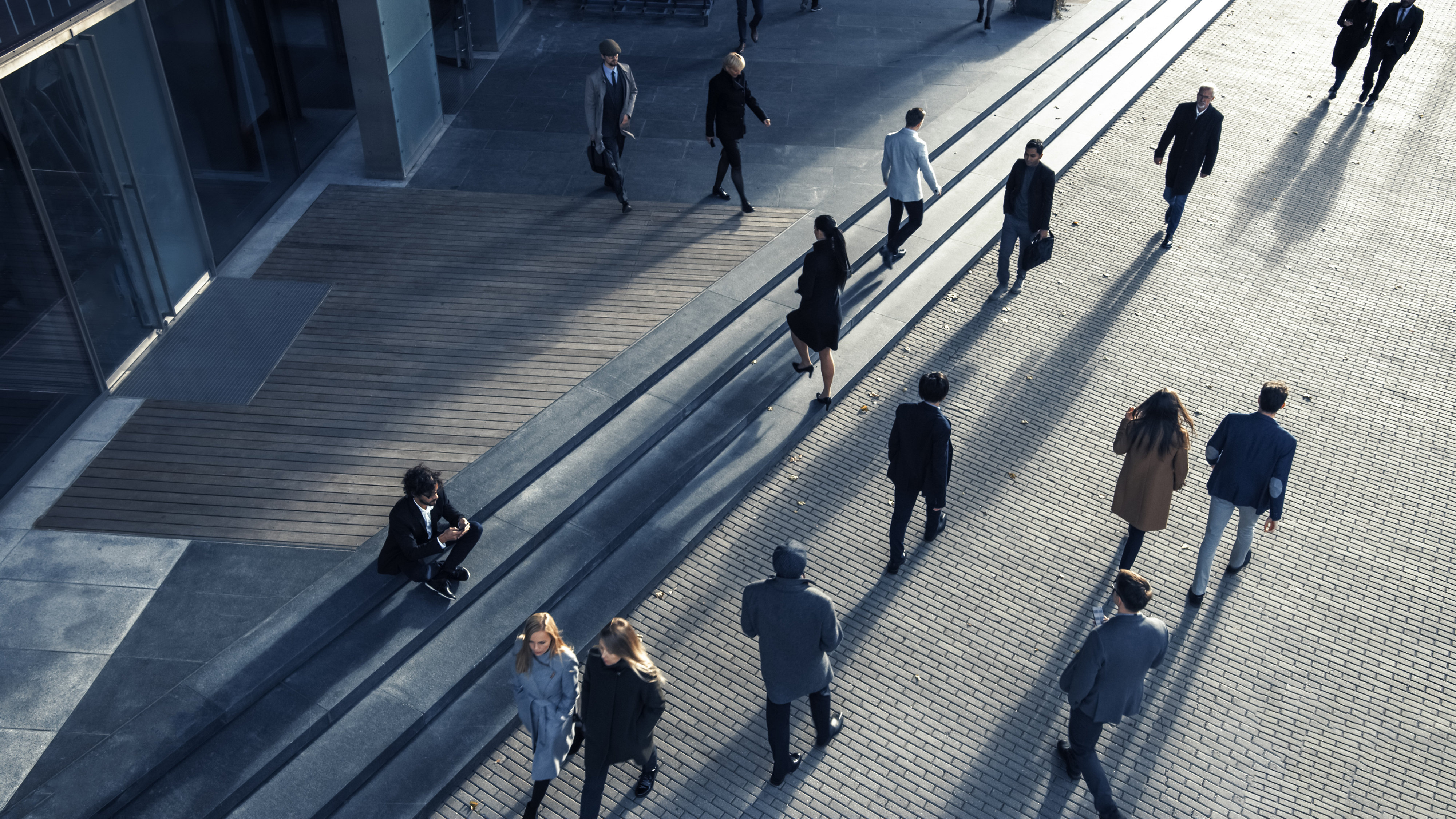 Commuters walking towards offices, viewed from above