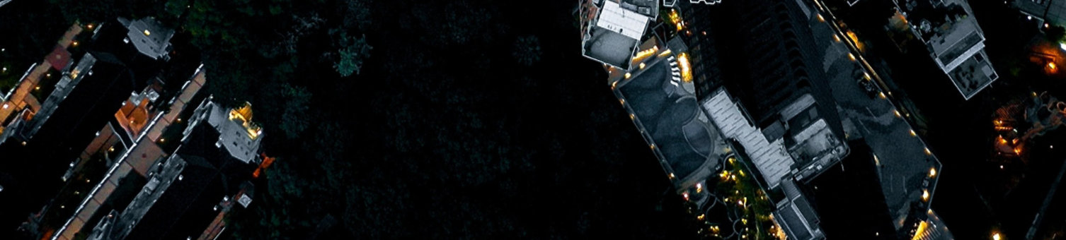 a big city from above with orange strands running through the streets