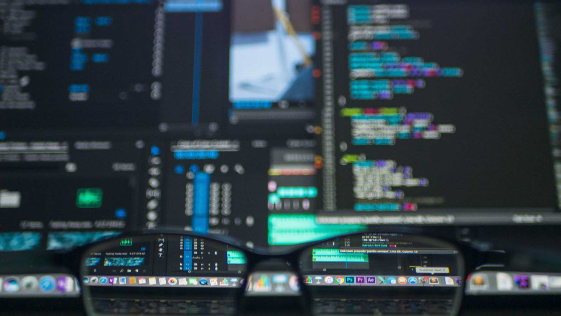 Image of data screen with glasses on desk