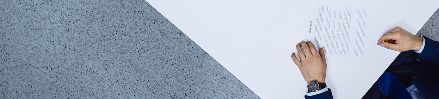 Group of business people and lawyer discussing contract papers sitting at the table, view from above. Businessman is signing document after agreement done; Shutterstock ID 1666594750; purchase_order: N/A; job: RICS Mediation, Expert Witness & DRS Imagery; client: RICS_PP; other: 