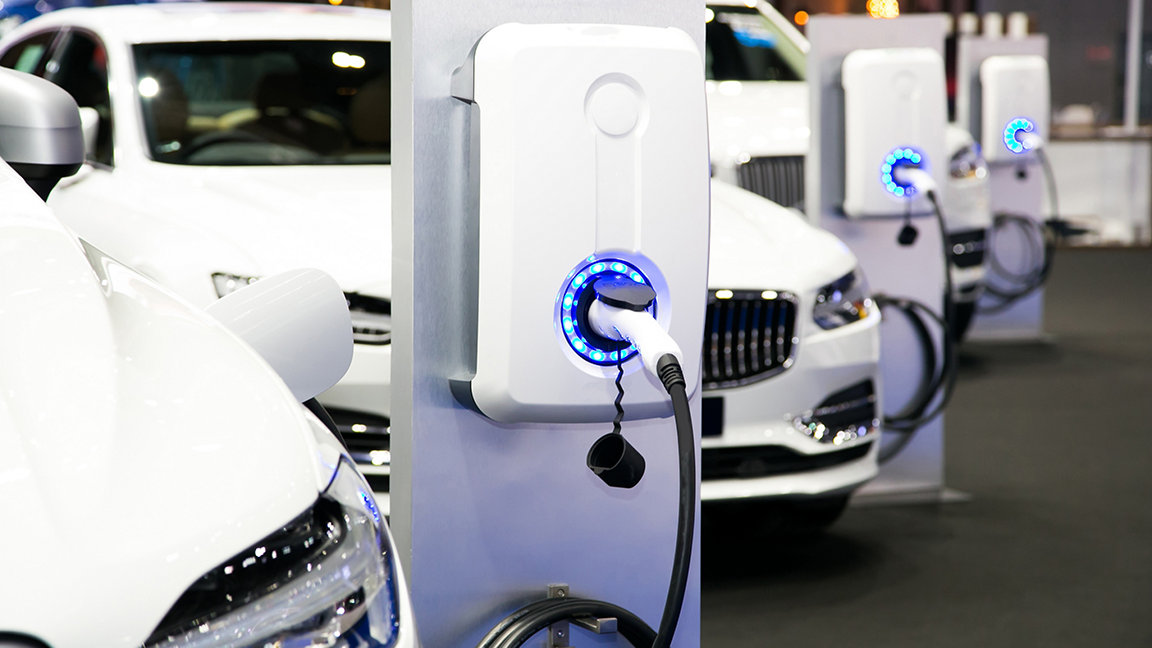 Electric cars charging at a public charging station