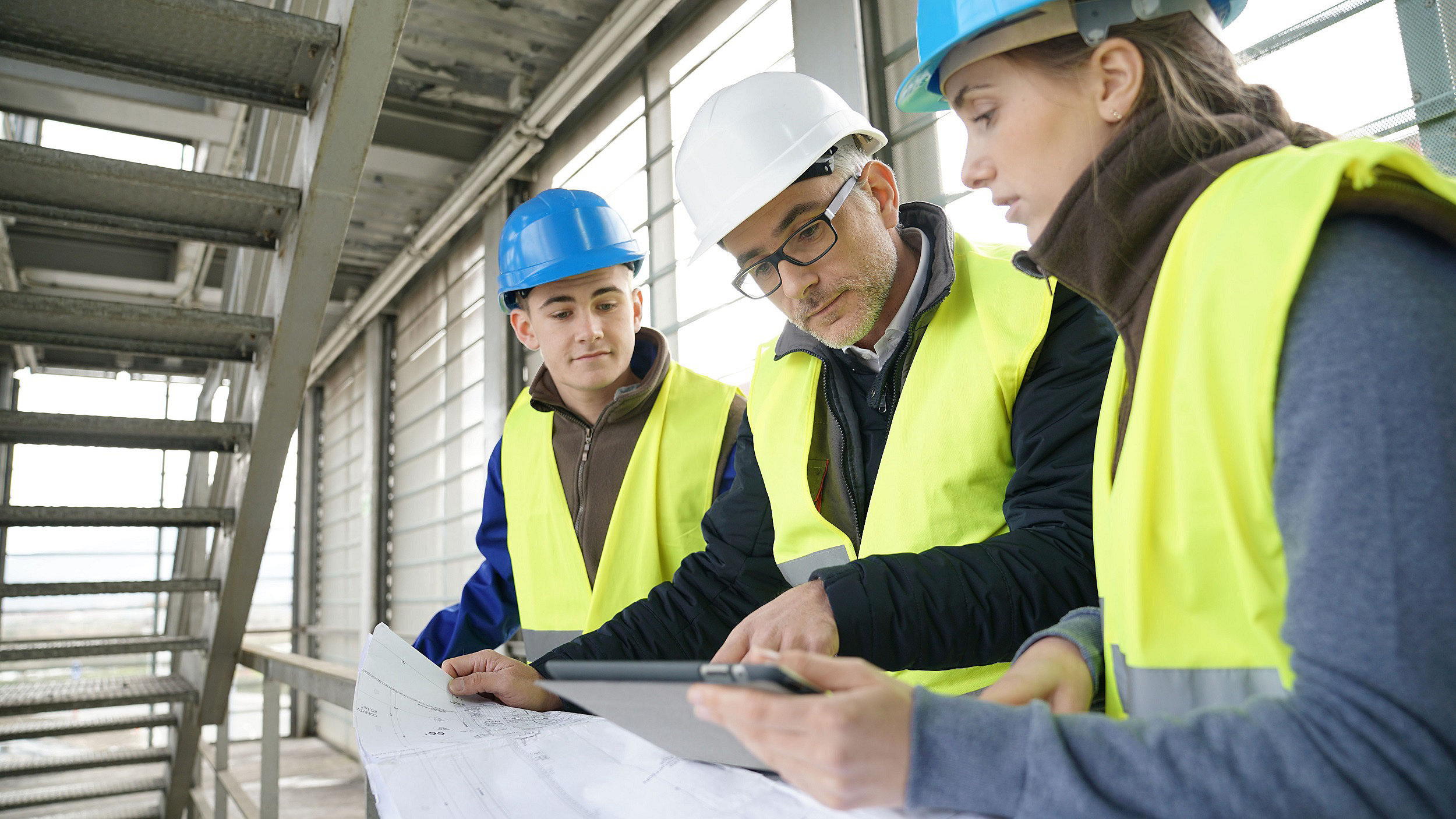 Two apprentices and a manager onsite