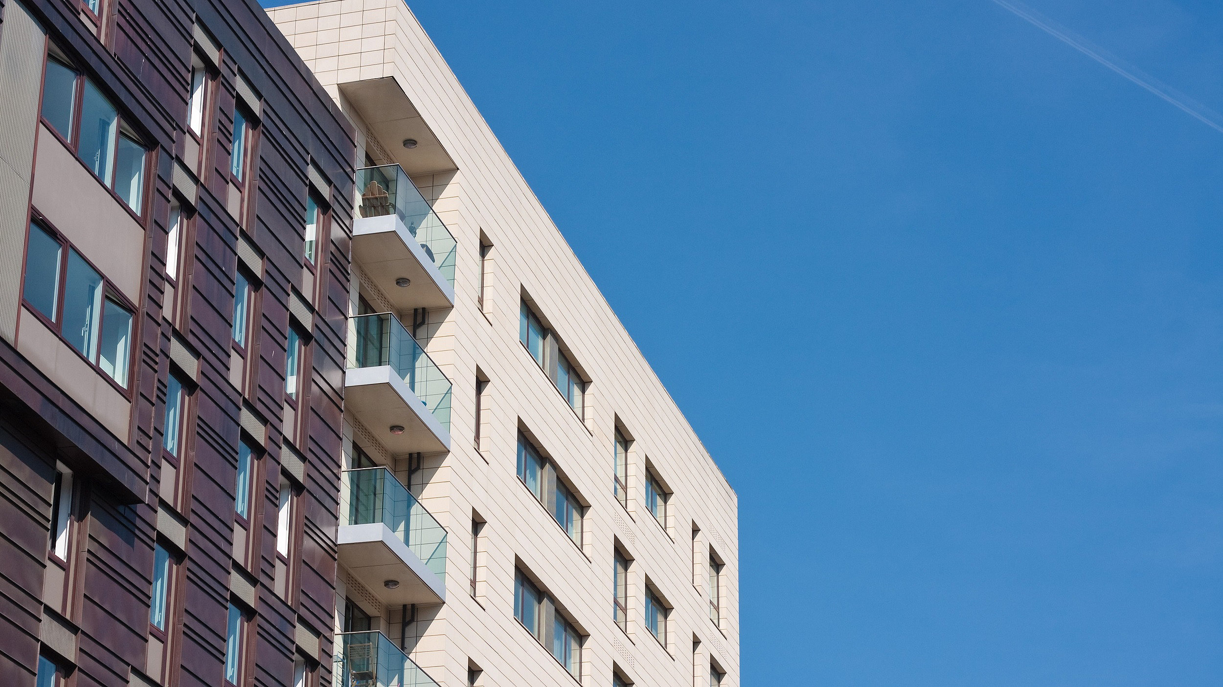 Block of flats against a blue sky