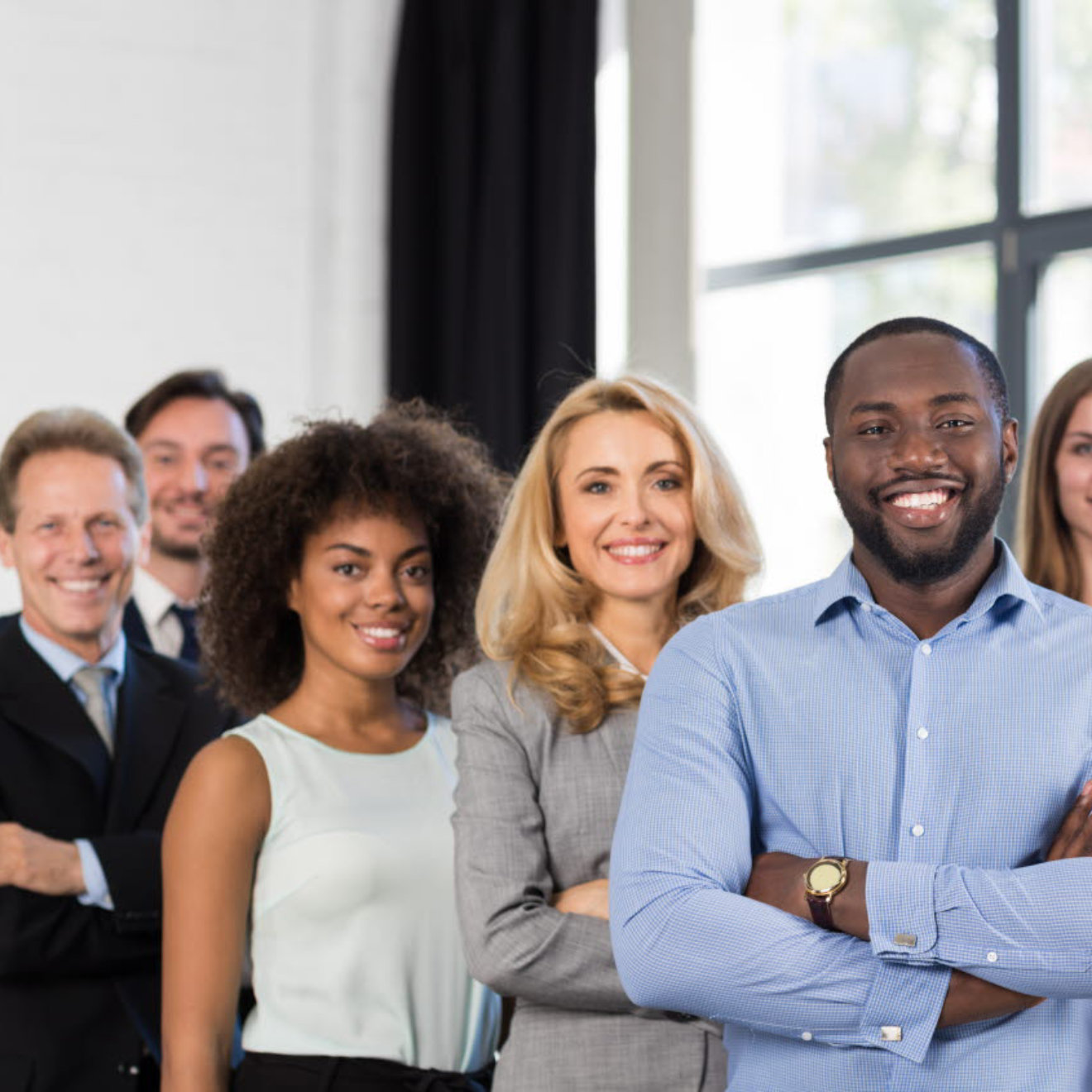 A diverse group of professionals standing together