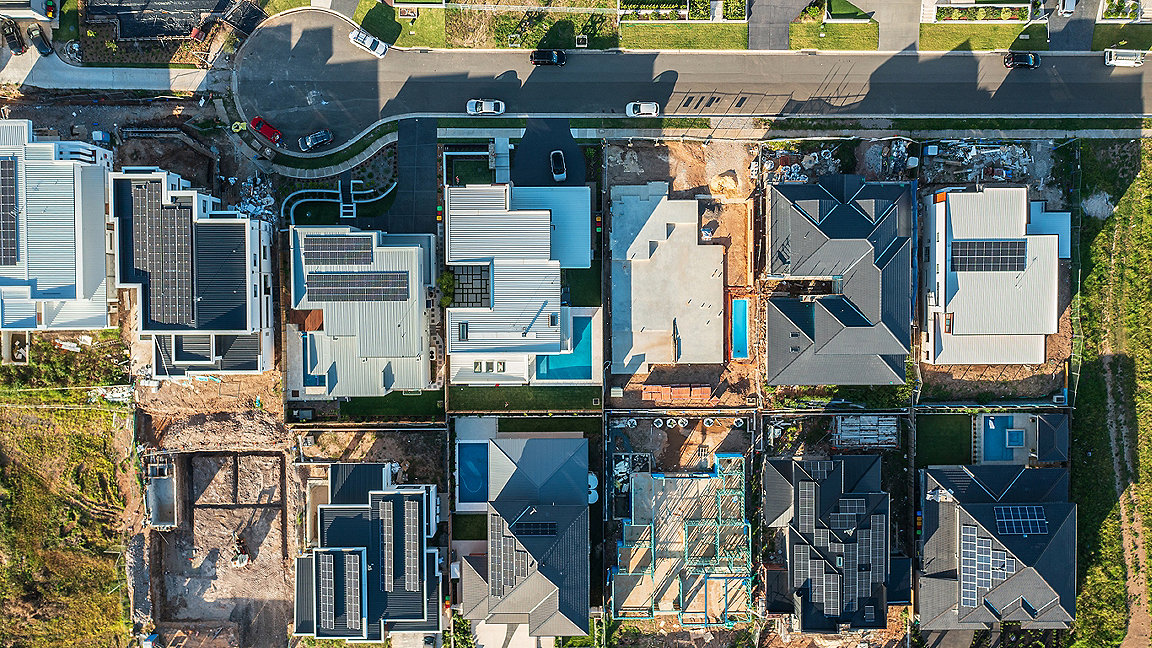 Aerial view of modern upmarket houses in various stages of completion