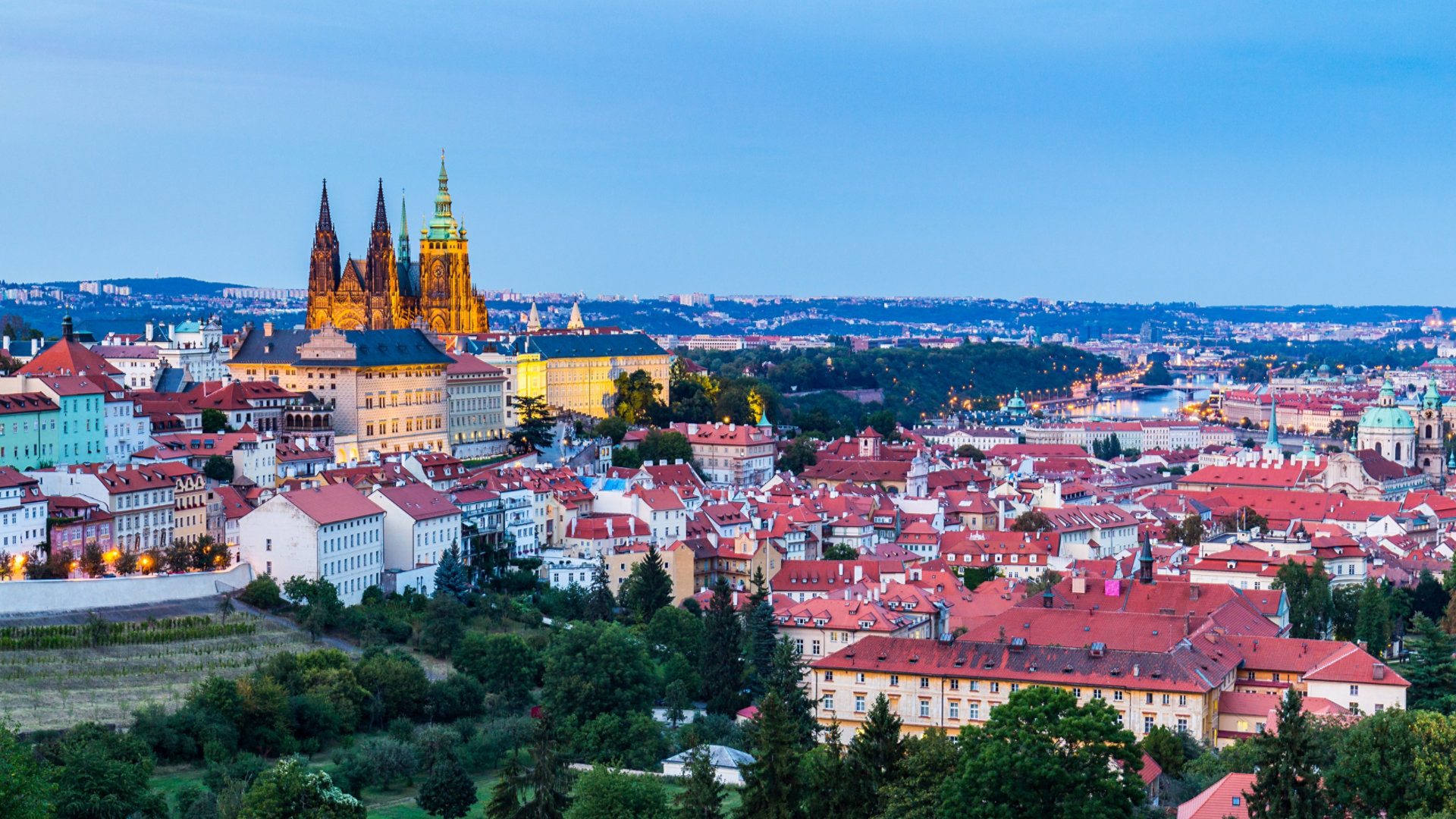 Evening summer Prague panorama from Prague Hill with Prague Castle, Vltava river and historical architecture. Concept of Europe travel, sightseeing and tourism.
