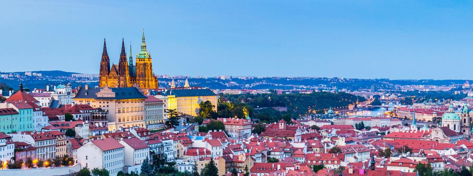 Evening summer Prague panorama from Prague Hill with Prague Castle, Vltava river and historical architecture. Concept of Europe travel, sightseeing and tourism.