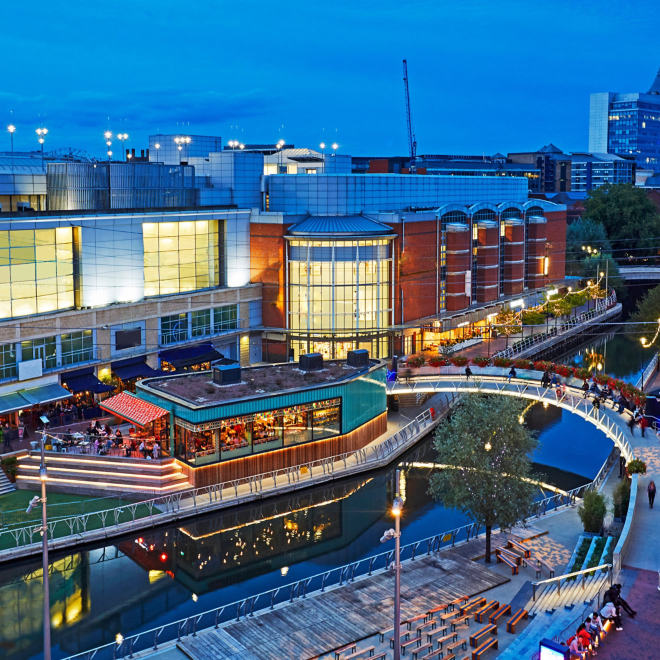 Aerial view of the 'Oracle' shopping centre illuminated at dusk in Reading, Berkshire uk; Shutterstock ID 1184294128; purchase_order: N/A; job: UK Commercial Property conference 2022; client: RICS_PP; other: 