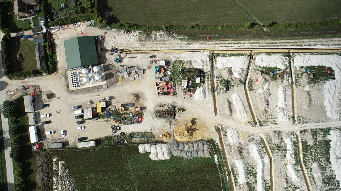 Aerial view of energy centre and bore hole field under construction