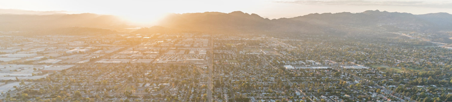 Sunset aerial view down Lassen Street in the Chatsworth area of the west San Fernando Valley region of Los Angeles, California.