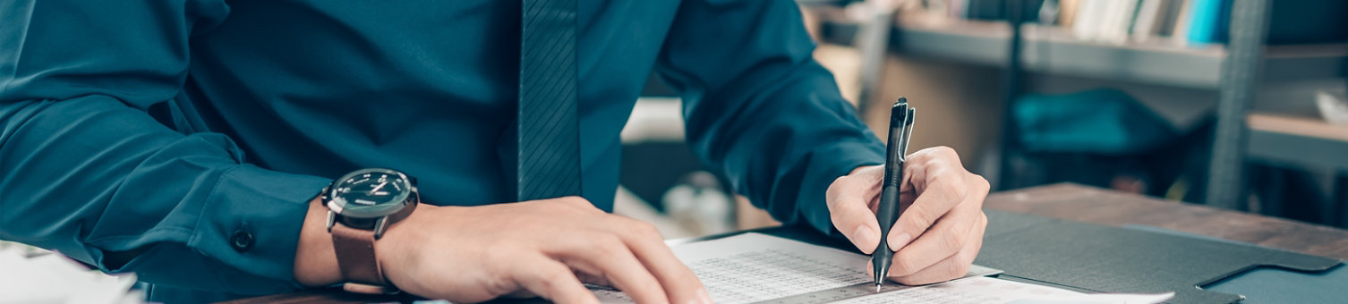 Businessman working on office desk and analyzing new project of accounting finance. Investment, Financial advisor and accounting concept.