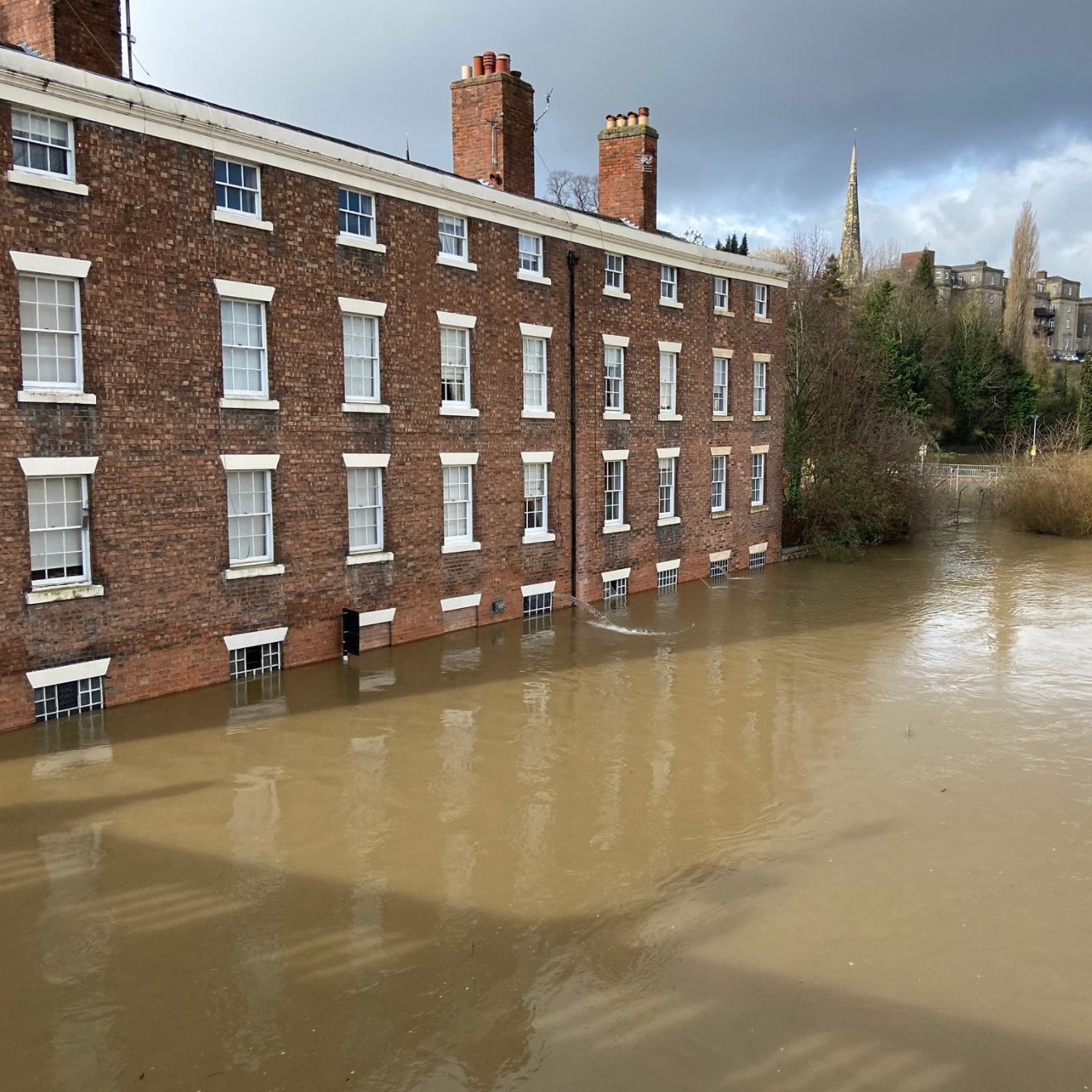 Flooded building on River Severn flooding in Shrewsbury, Shropshire, UK