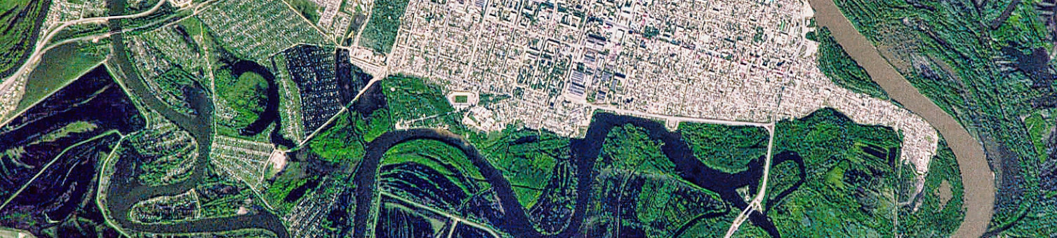 Aerial view of a suburban intersection with green grass and roads. The photo showcases the urban design and landscape patterns, highlighting the relations. Elements of this image furnished by NASA