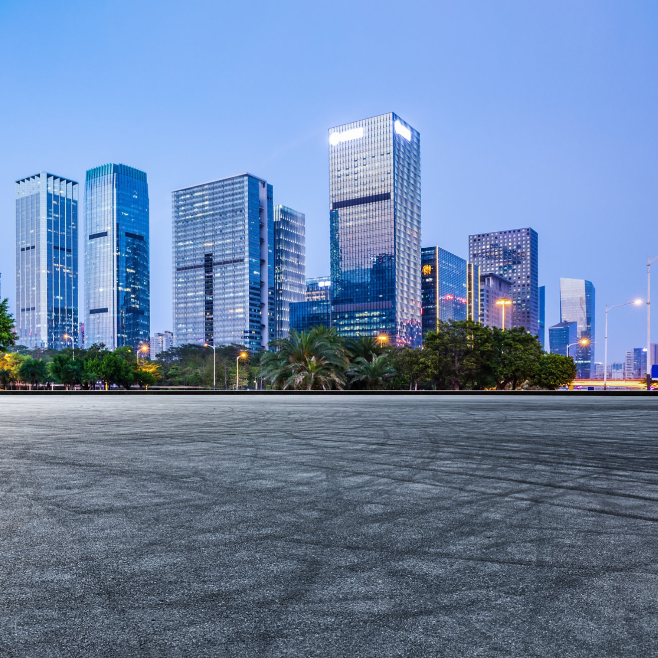 Panoramic skyline and modern commercial office buildings with empty road in Shenzhen, China. Asphalt road and cityscape.