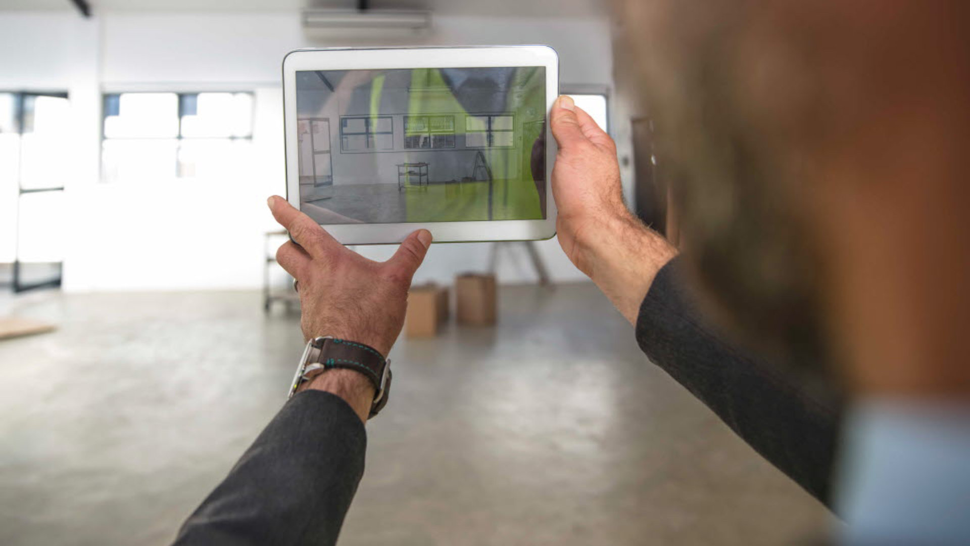 Person taking picture with a tablet