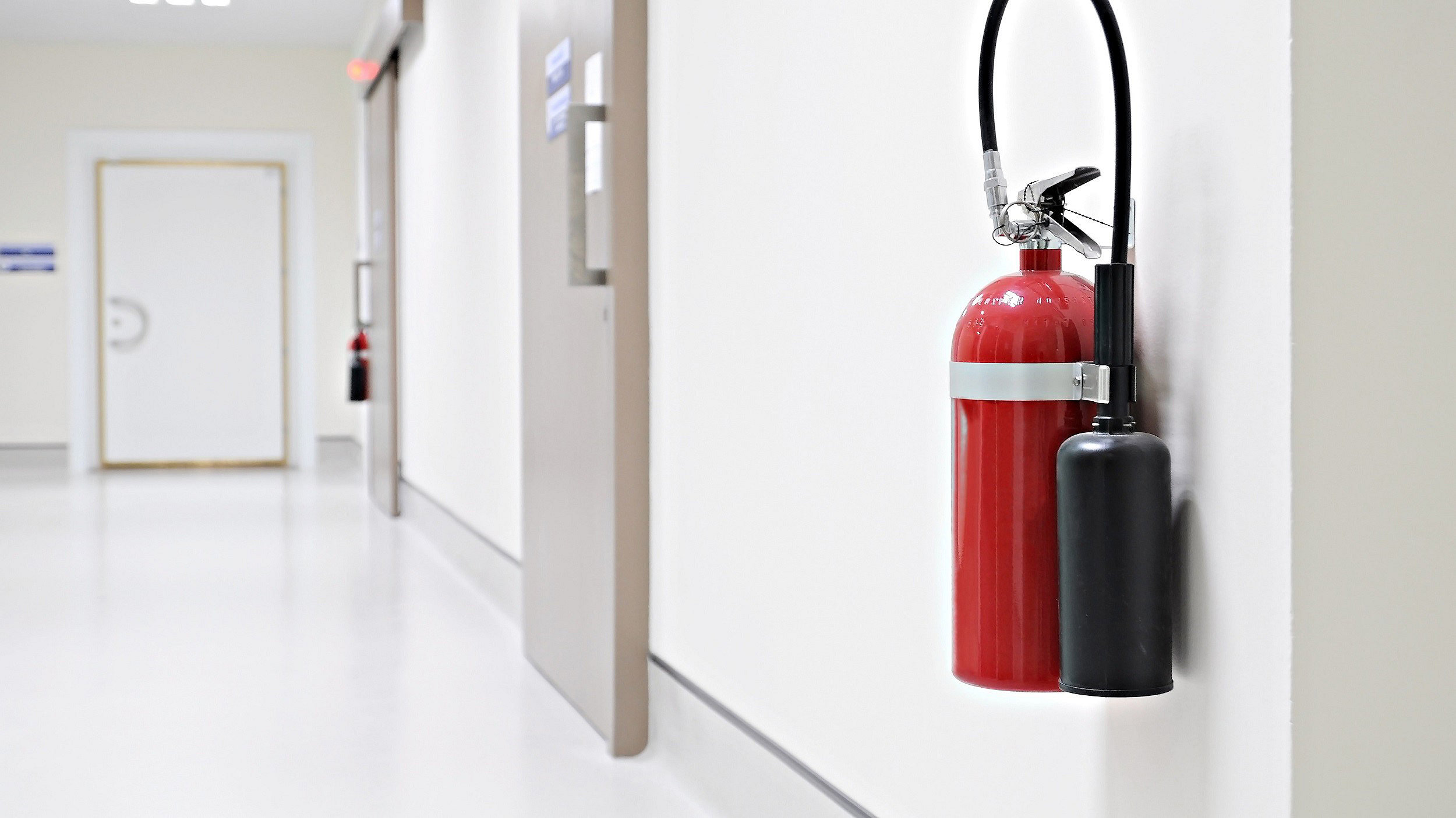 Fire extinguisher system on wall