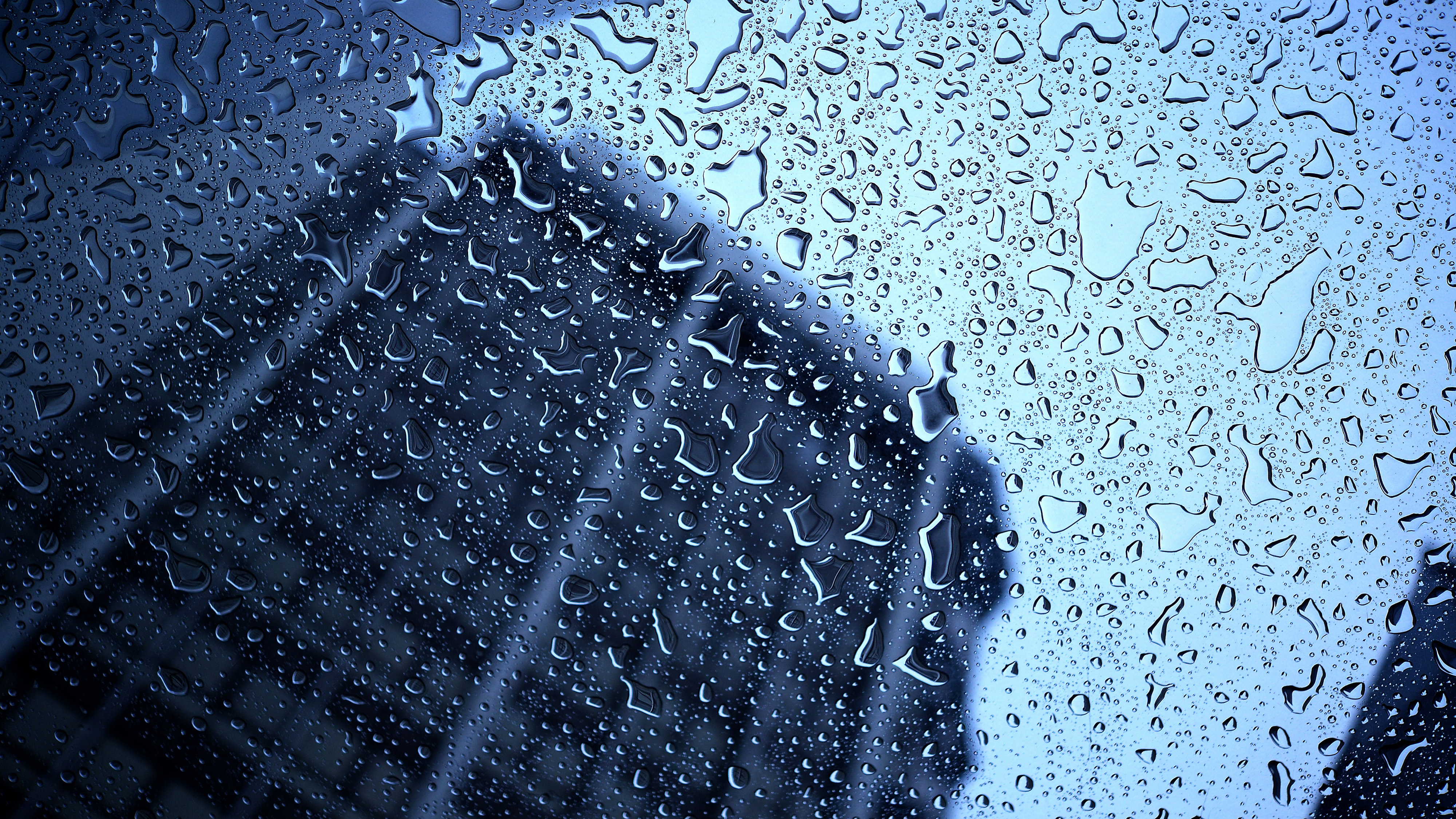 Office building seen through rainy window