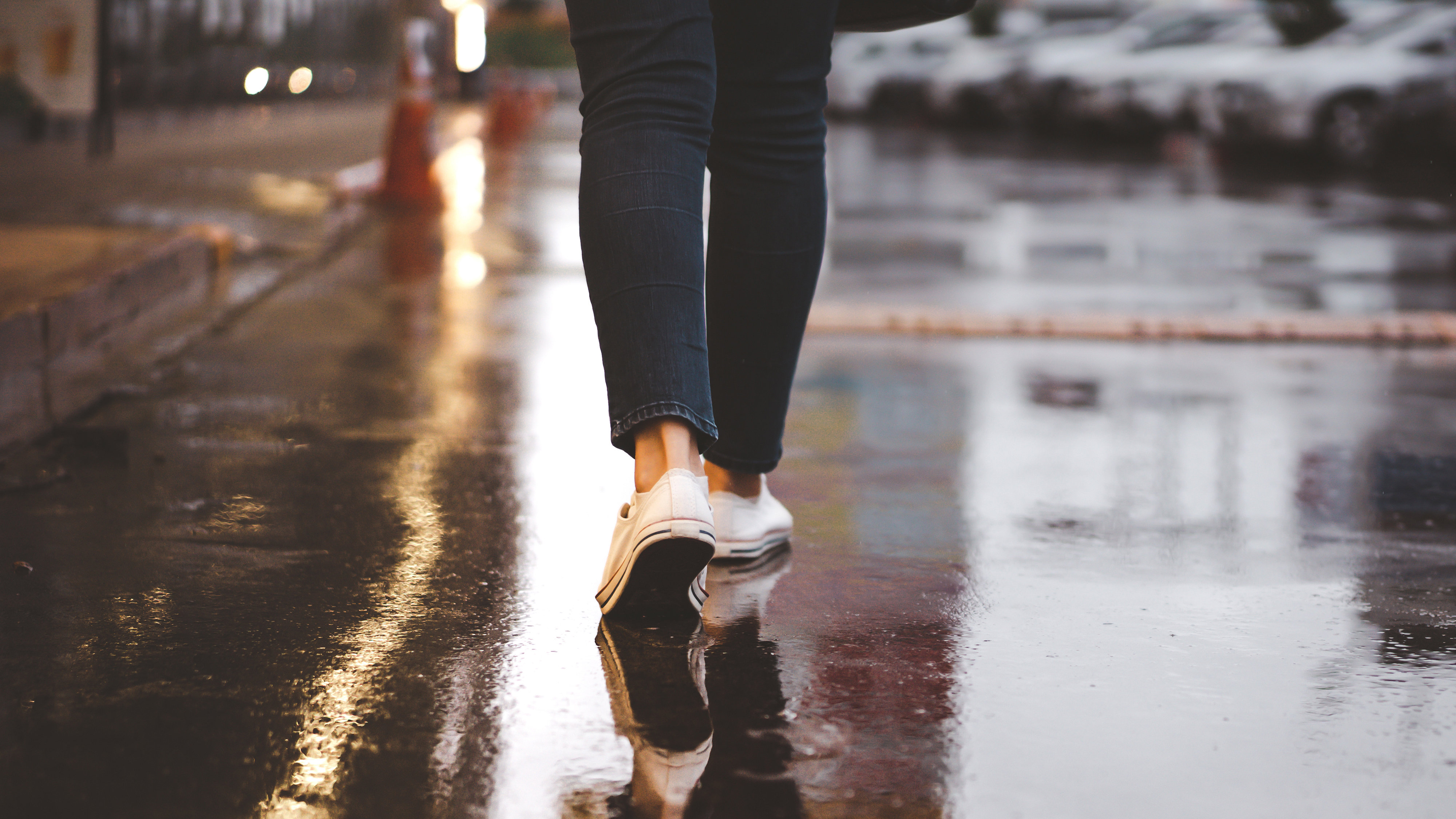 Close-up of woman's feet walking in a city street