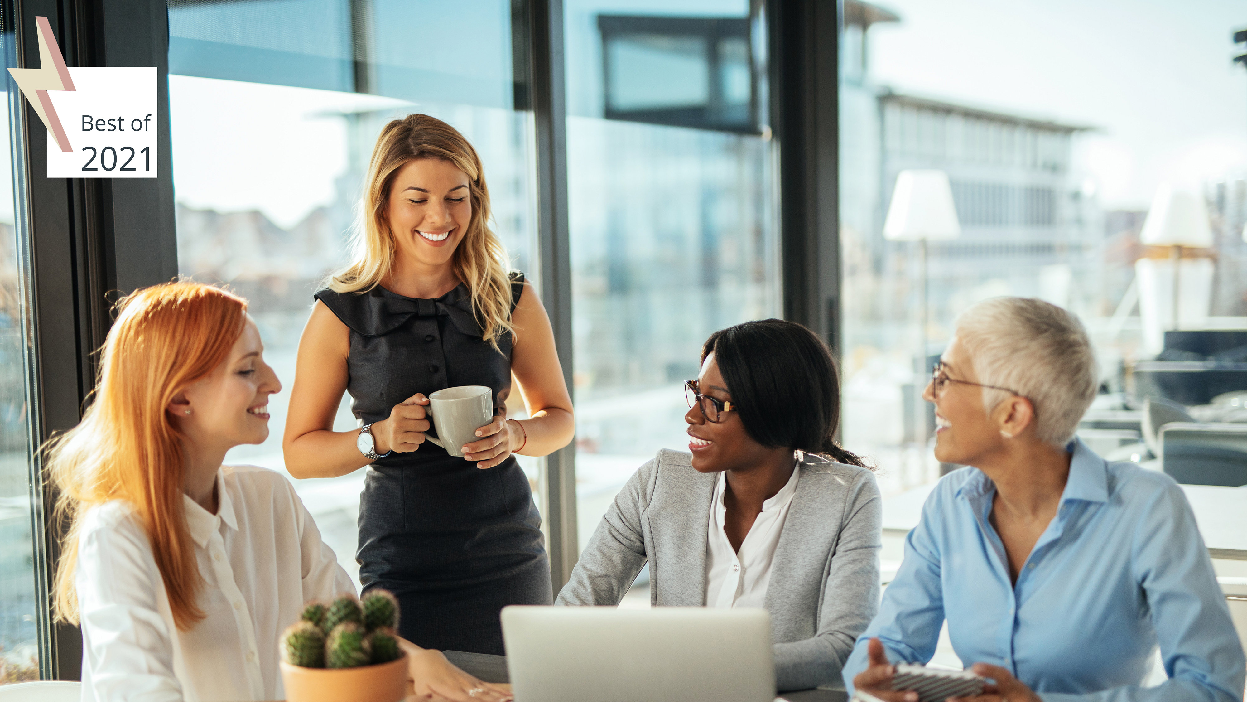 Seated young black woman surrounded by white women of different ages