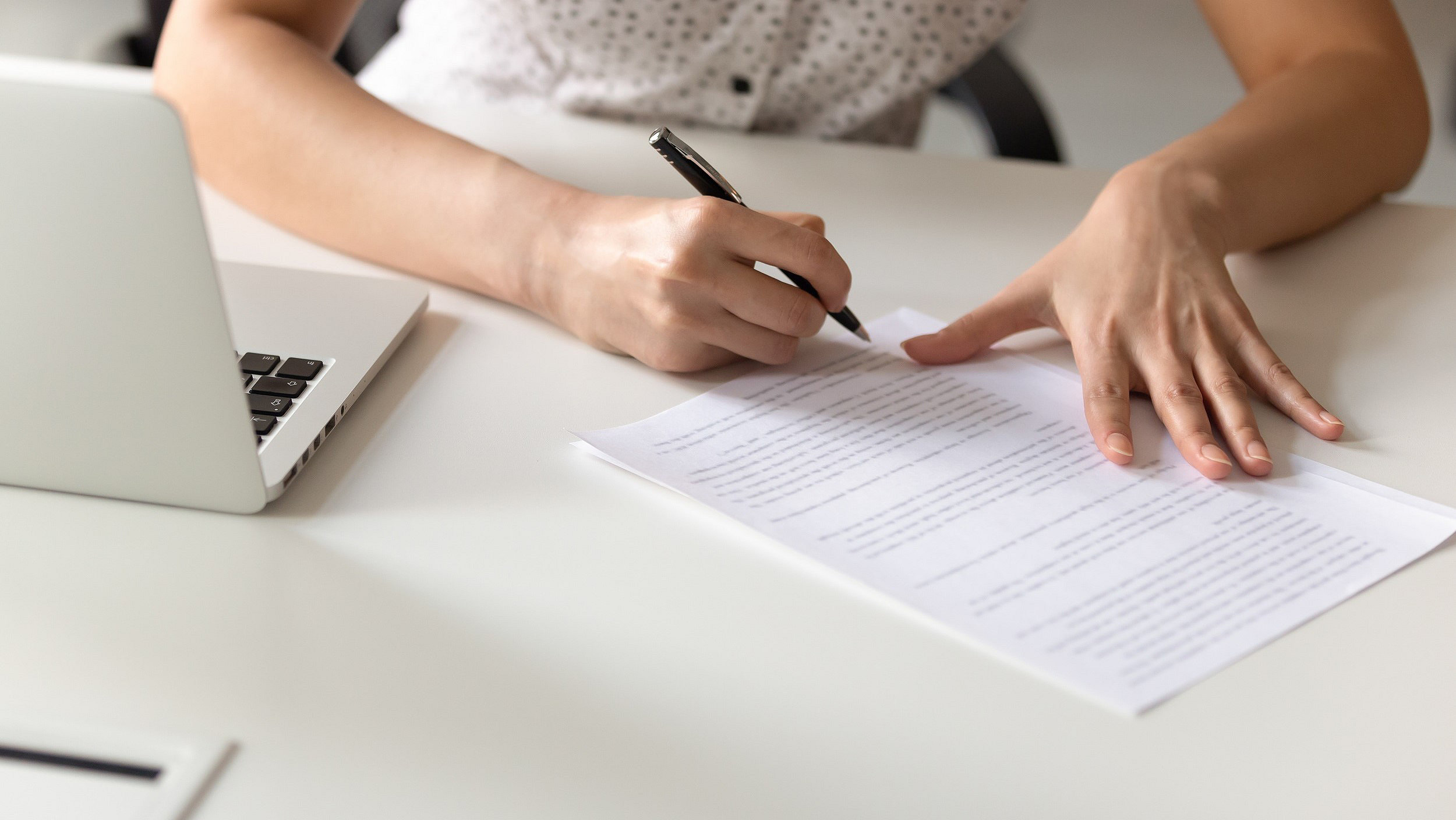 Woman filling in paper