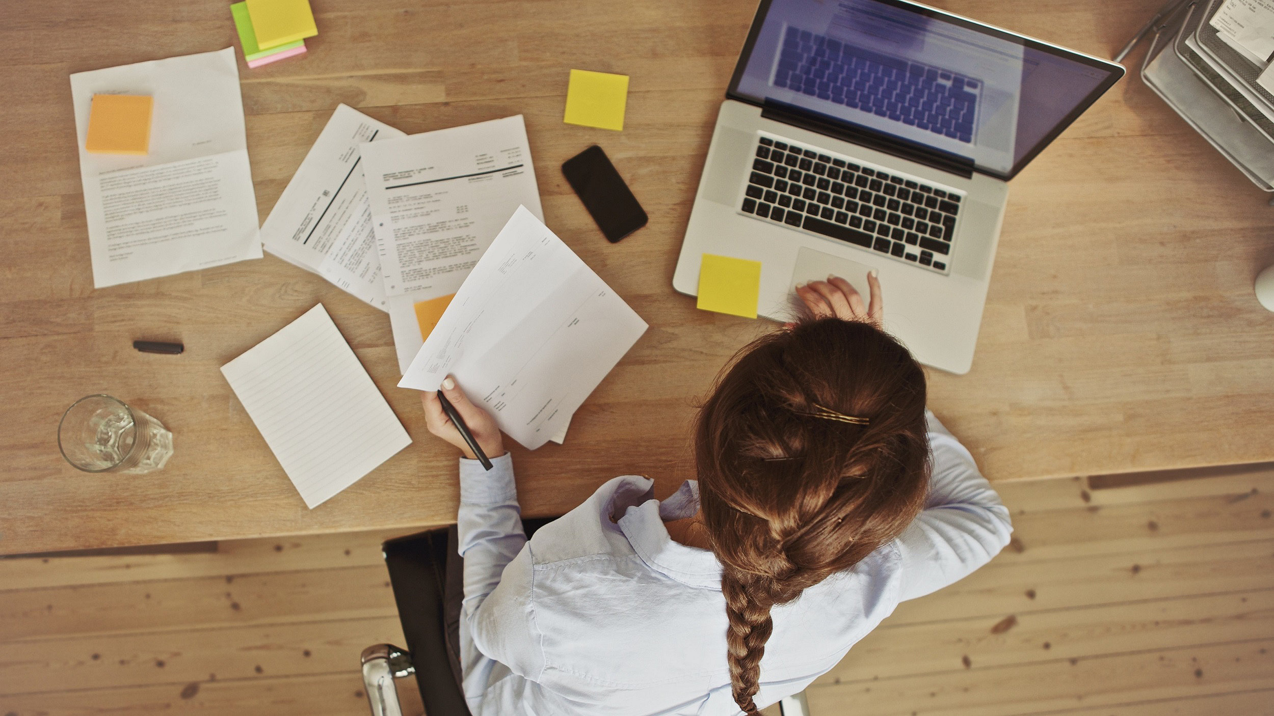 Aerial view of businesswoman with laptop