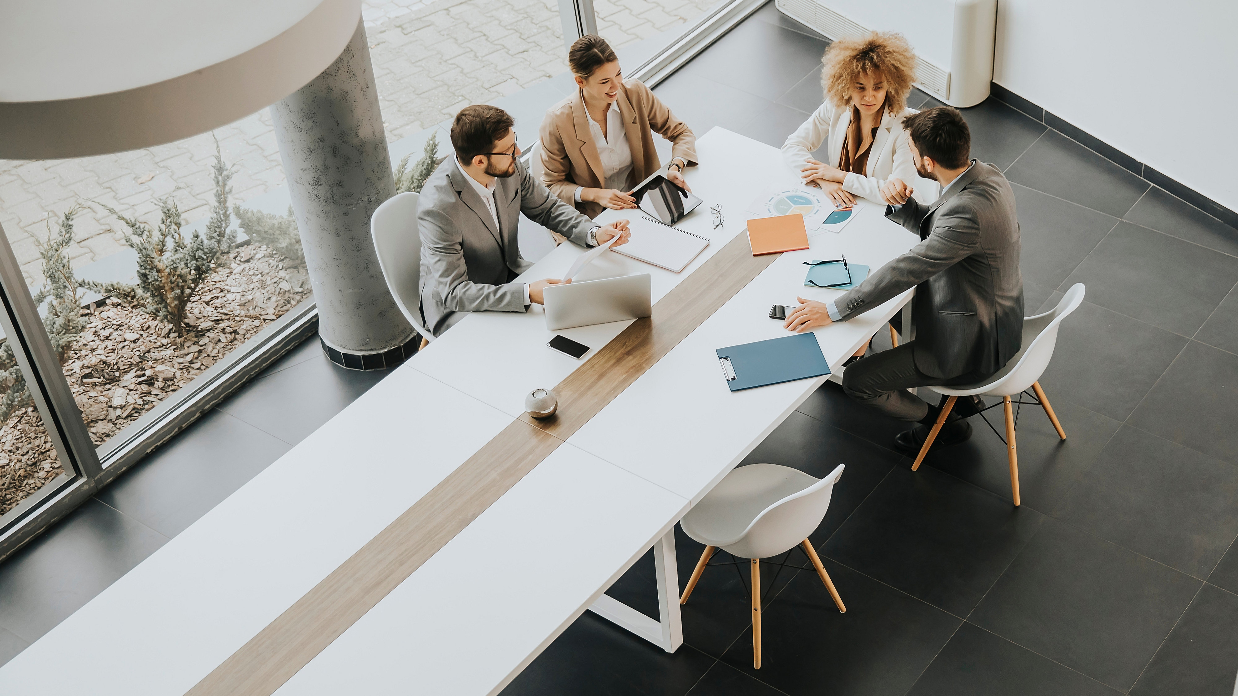 Overhead view at group of multiethnic business people working together in the office