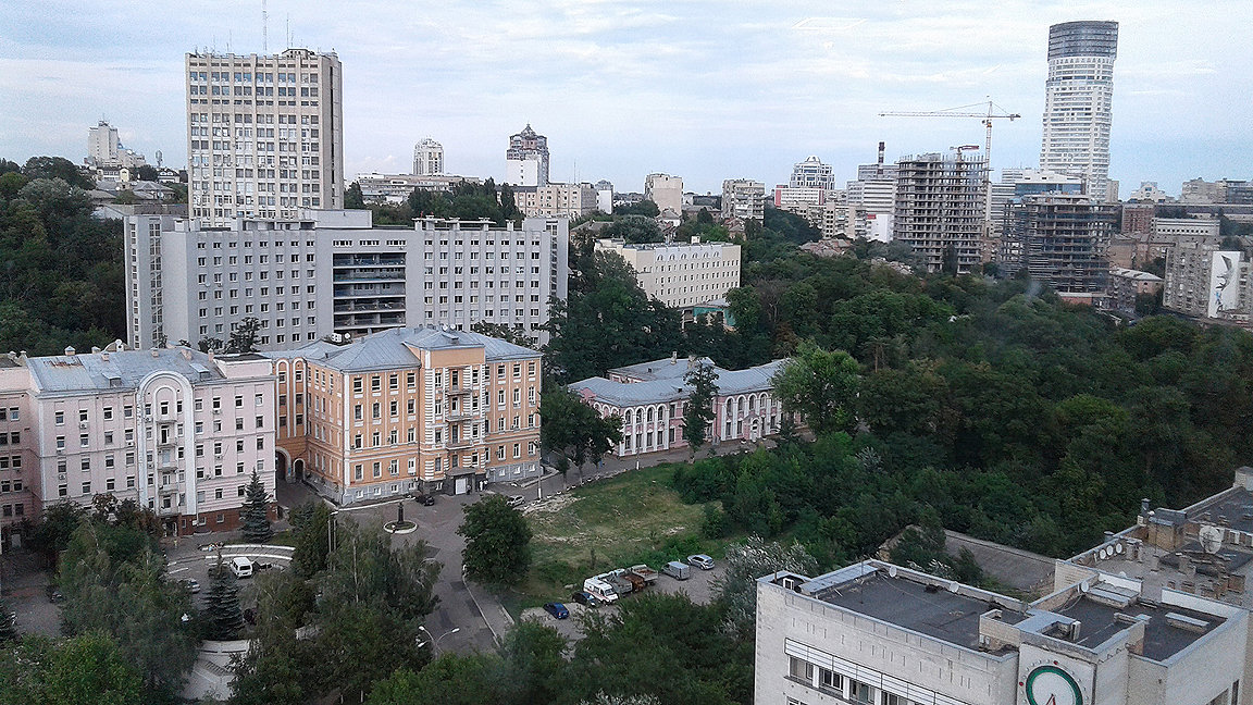 Photo of urban streetscape in Kyiv including high-rise and low-rise residential buildings