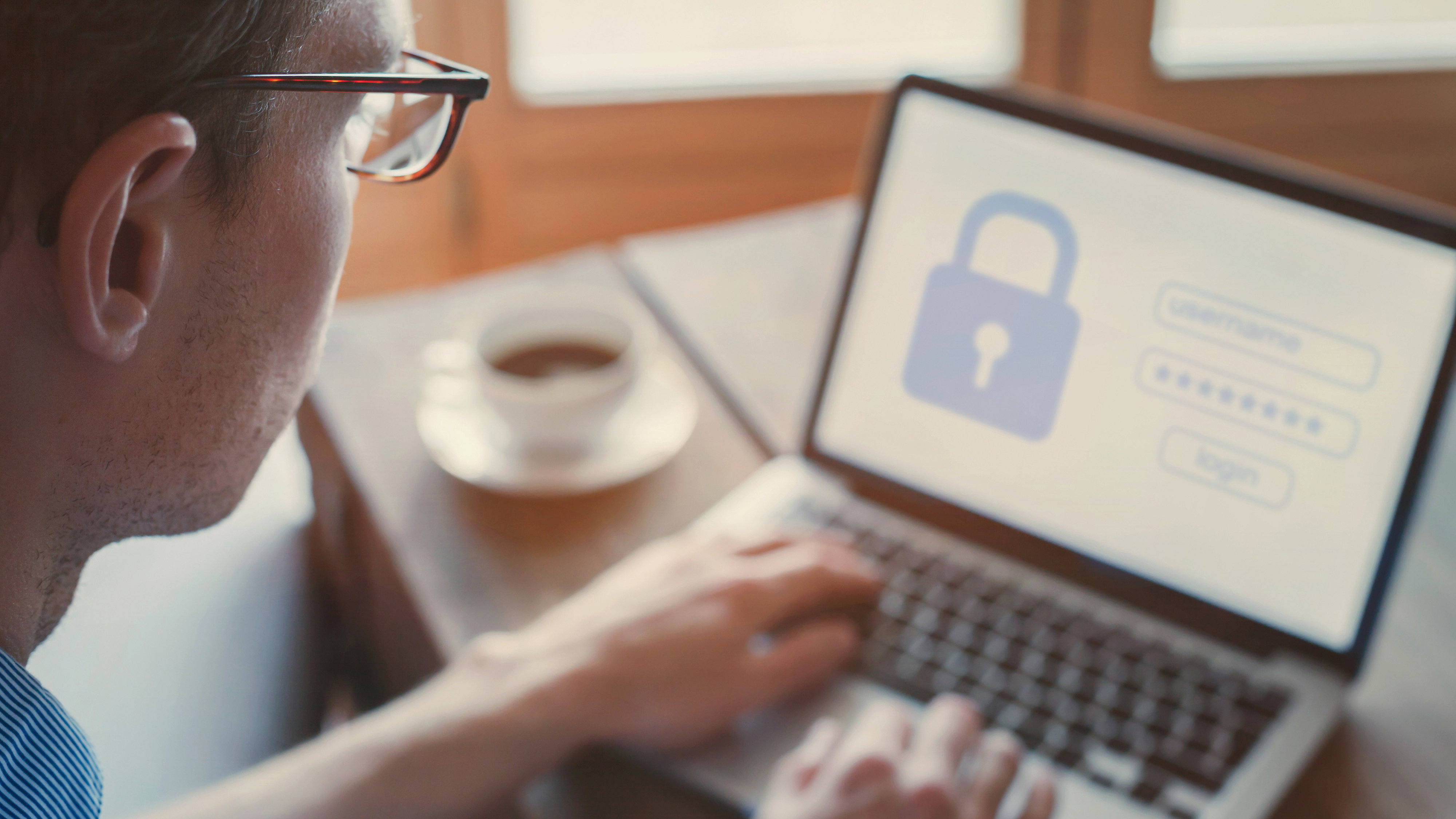 Man signing securely into a service on a laptop