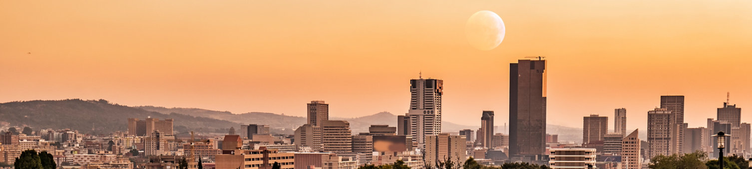 Sunset shot of City of Pretoria with moon in the sky from Union Building Park Gauteng South Africa
