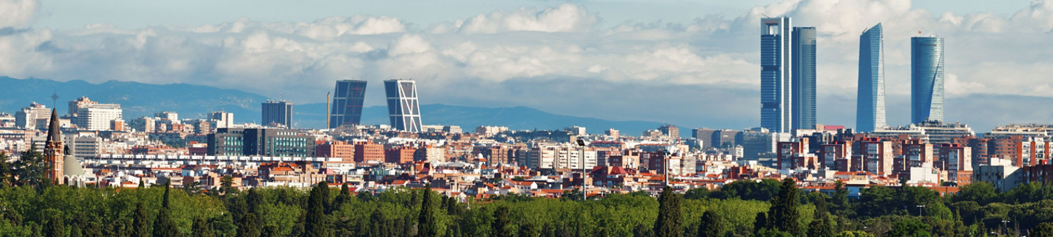 Madrid rooftop view of the city skyline with business district skyscrapers in Spain.