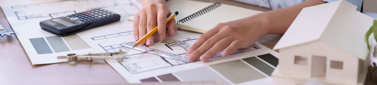 Asian women adult hands meticulously working on architecture design blueprint. Project showcases house layout renovation and construction. 