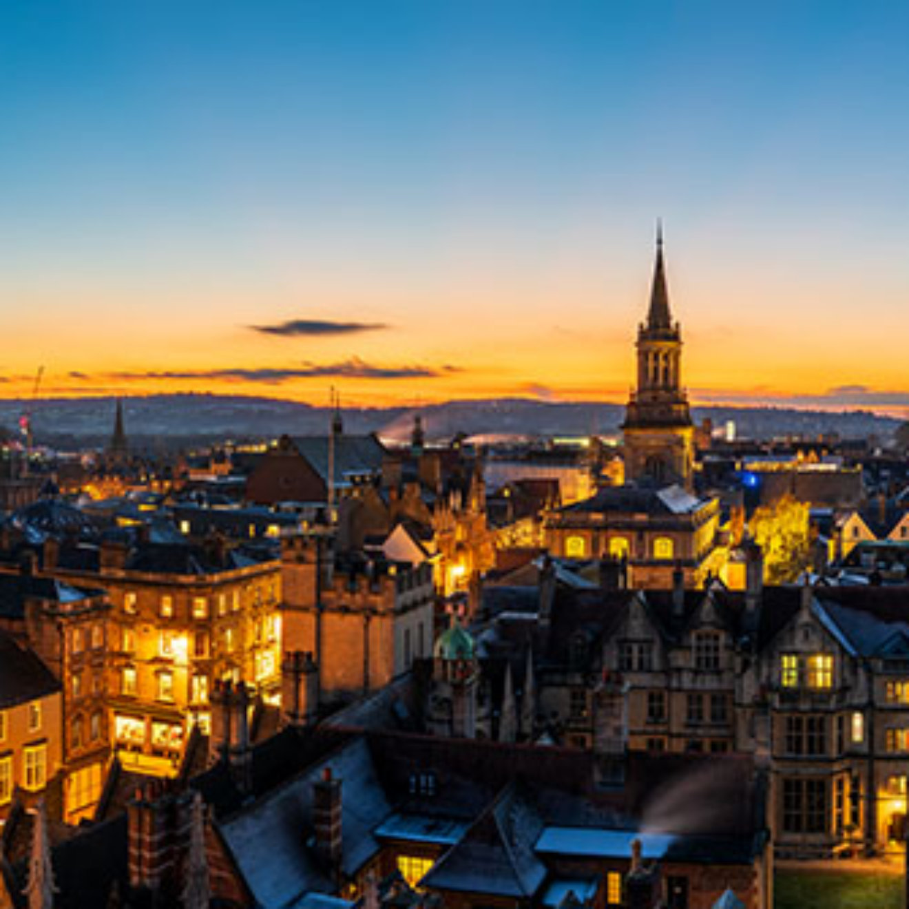 Oxford city aerial rooftop skyline at sunset. England
