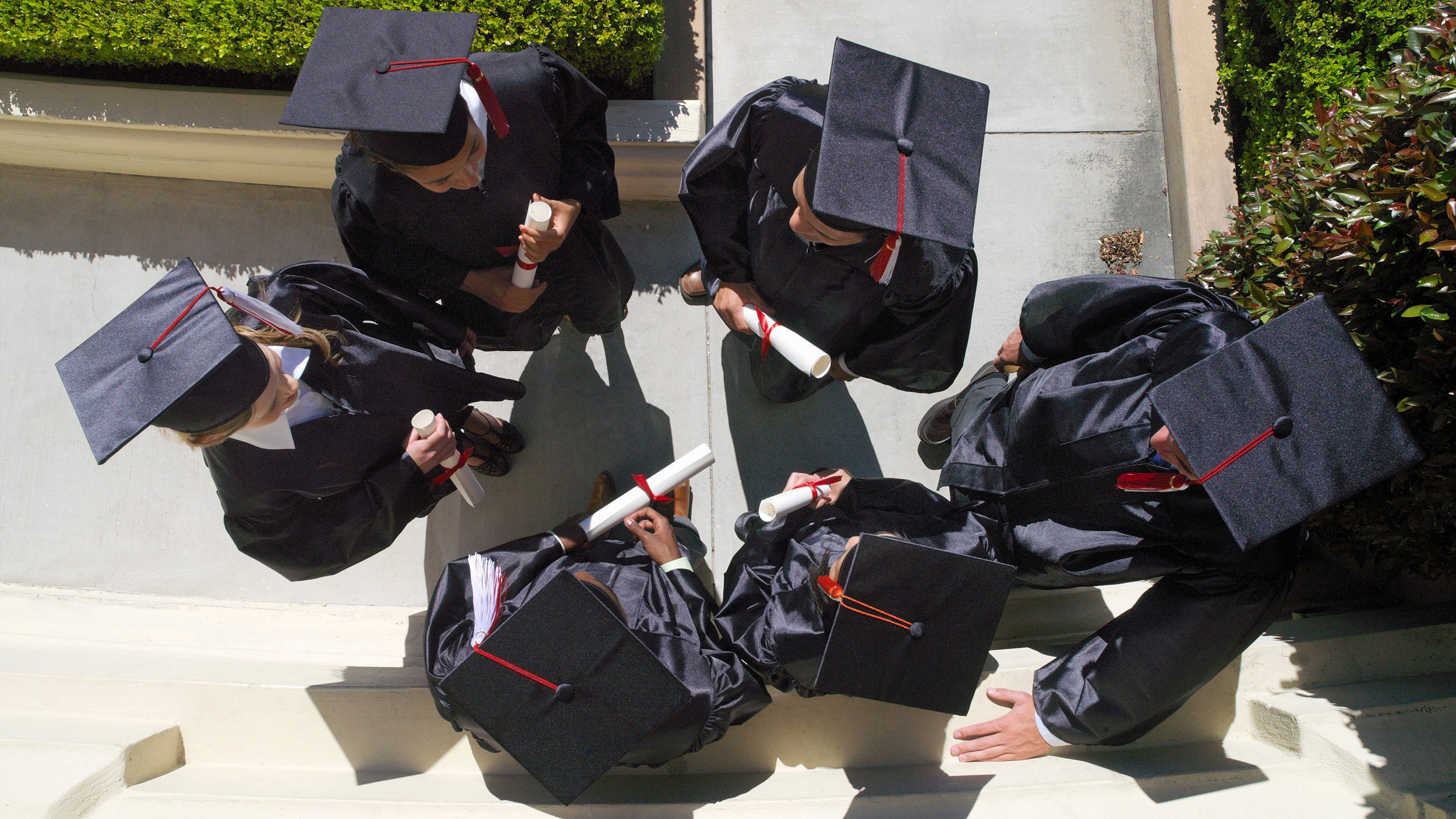 overhead picture of graduates in gowns