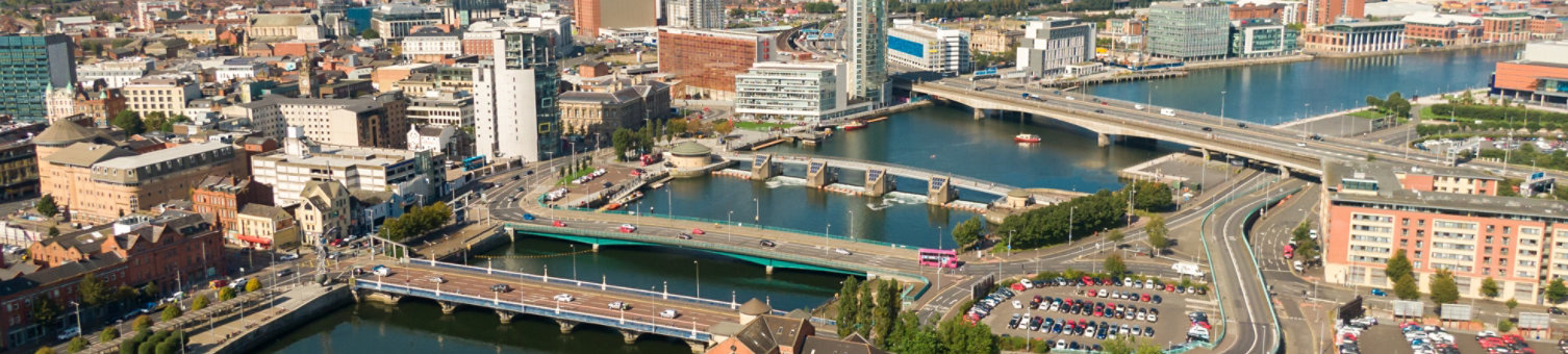 Aerial view on river and buildings in City center of Belfast Northern Ireland. Drone photo, high angle view of town 