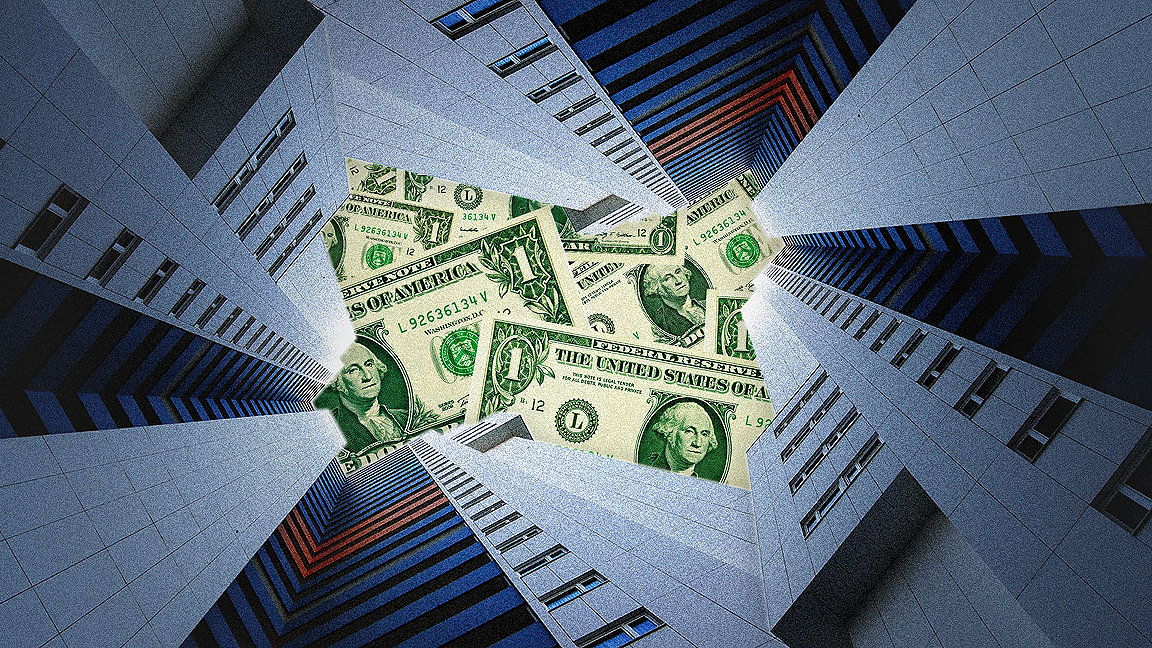 Dollar bills hidden by tower blocks