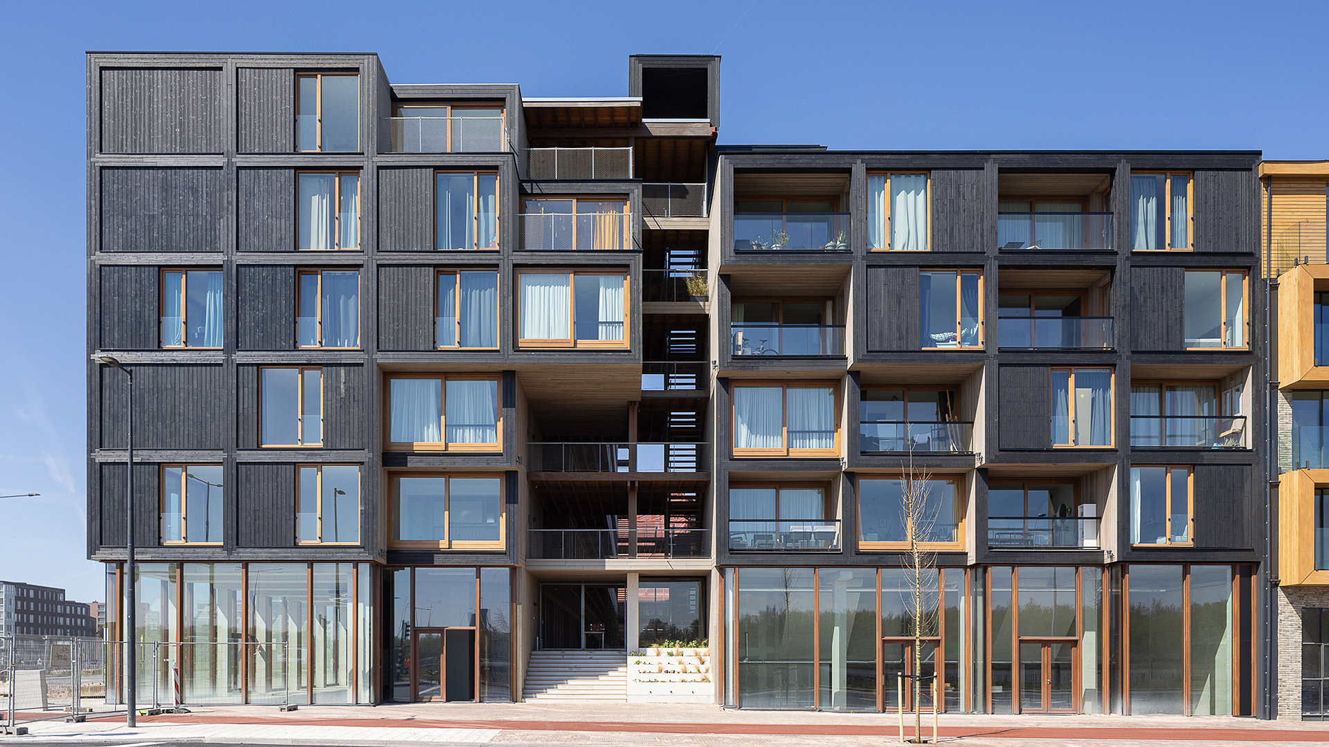 Dark wood panelled exterior of residential building