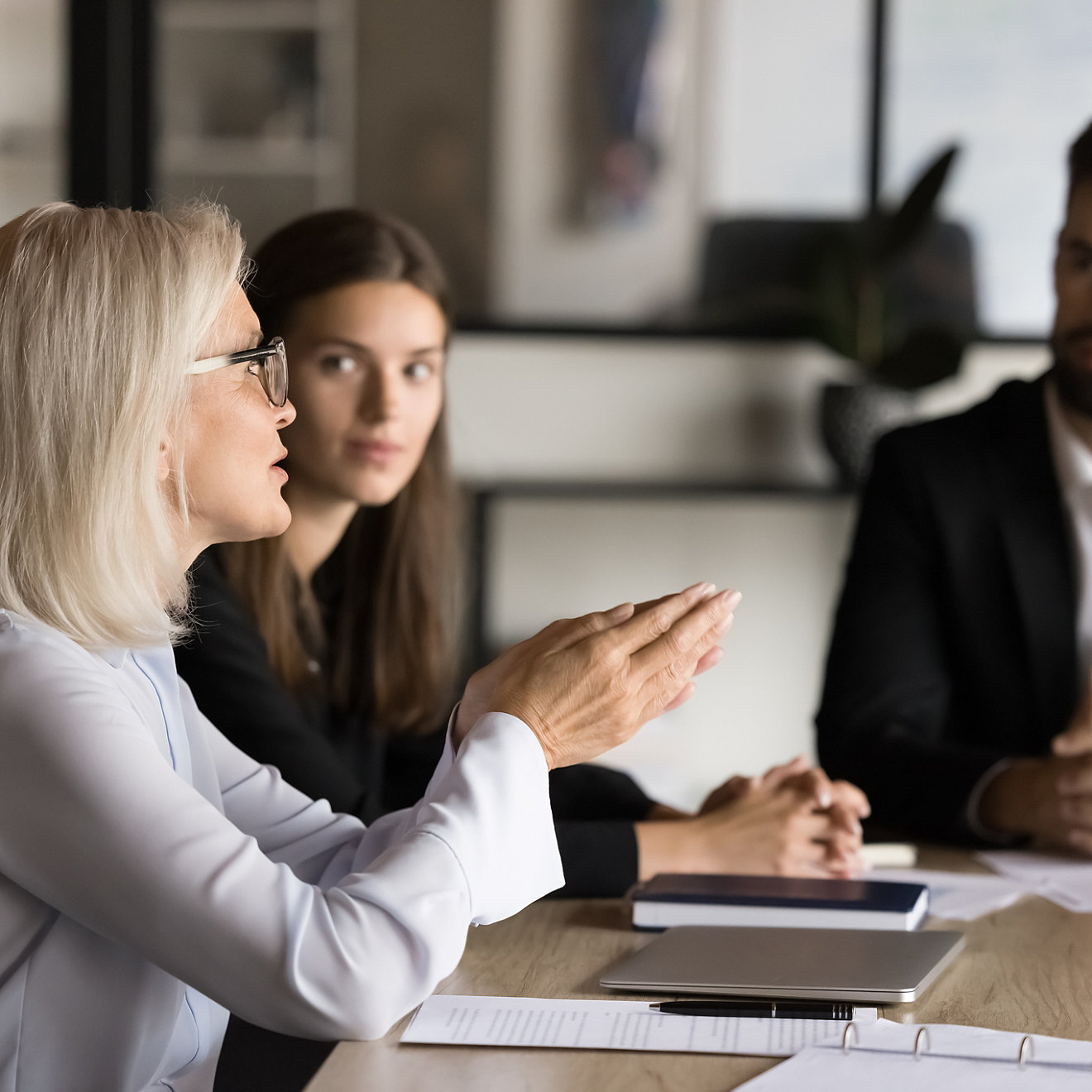 people in a meeting talking