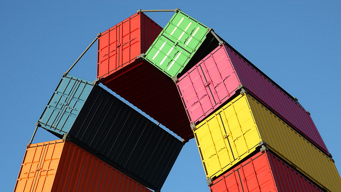 Multi coloured shipping containers in arch shape