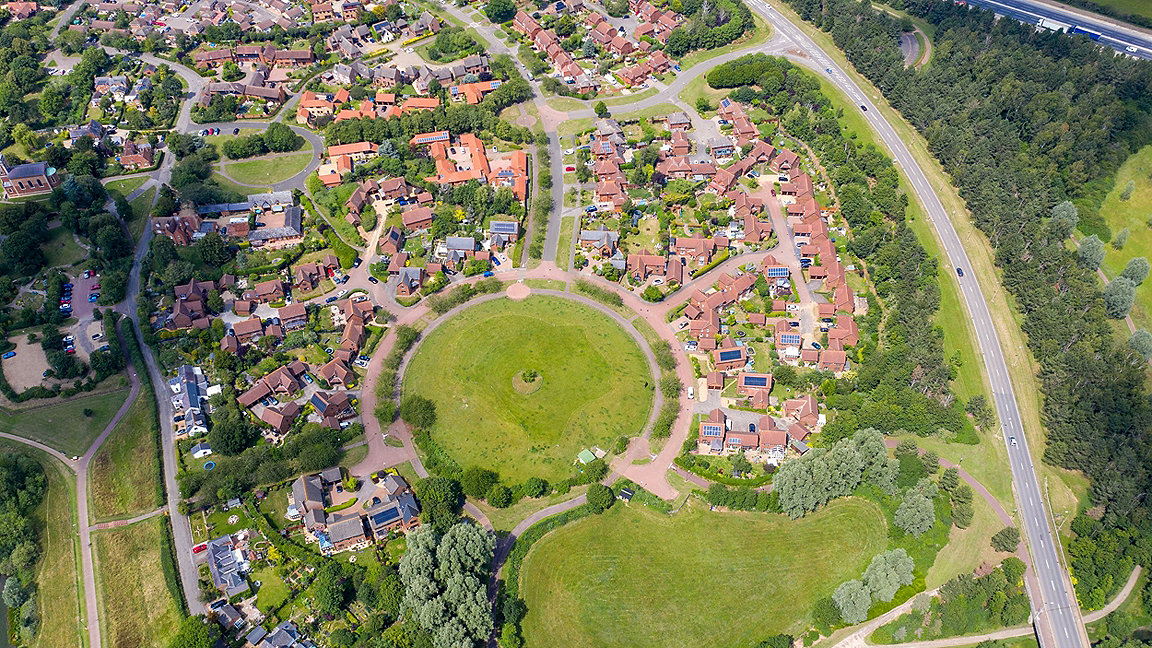Overhead photo of a housing estate and green roundabout in Milton Keynes
