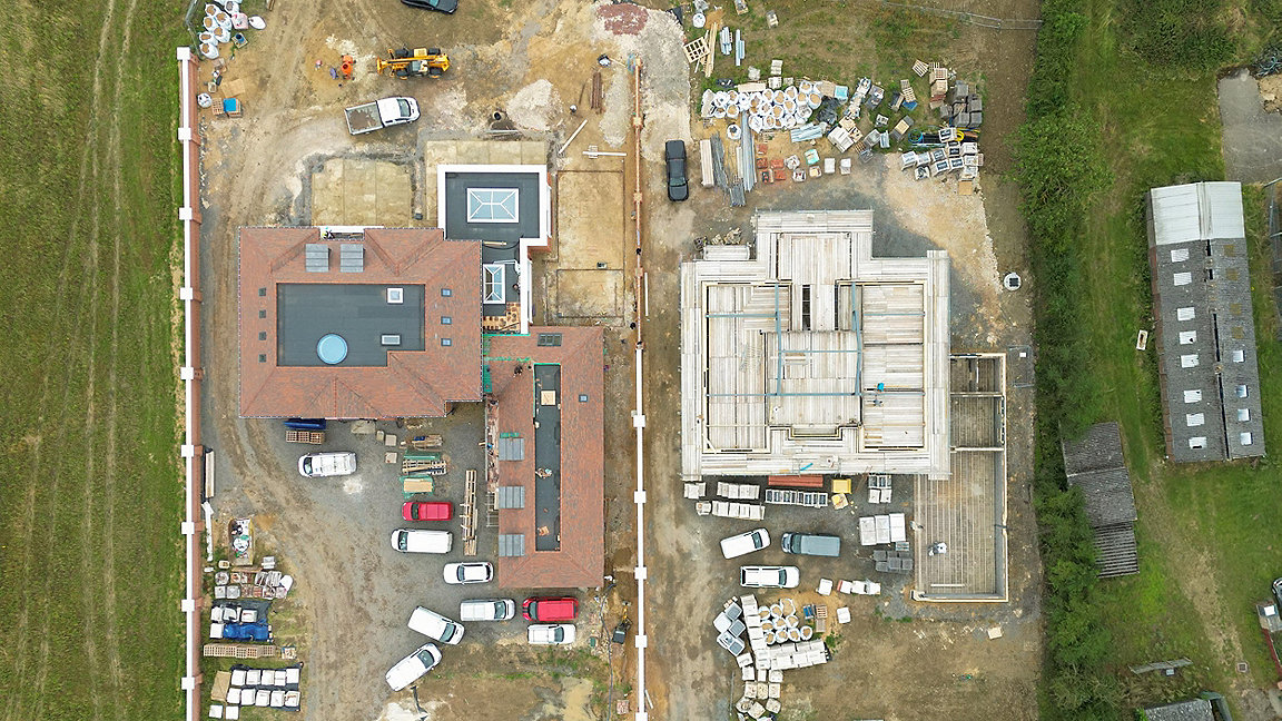 overhead image of rural large building under construction