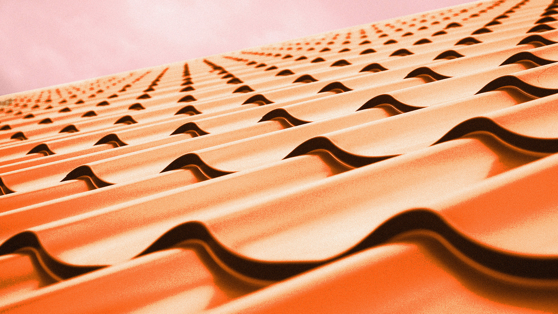 Red tiled roof against blue sky