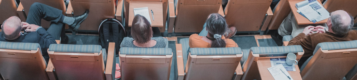 A group of people seated in an auditorium for an event