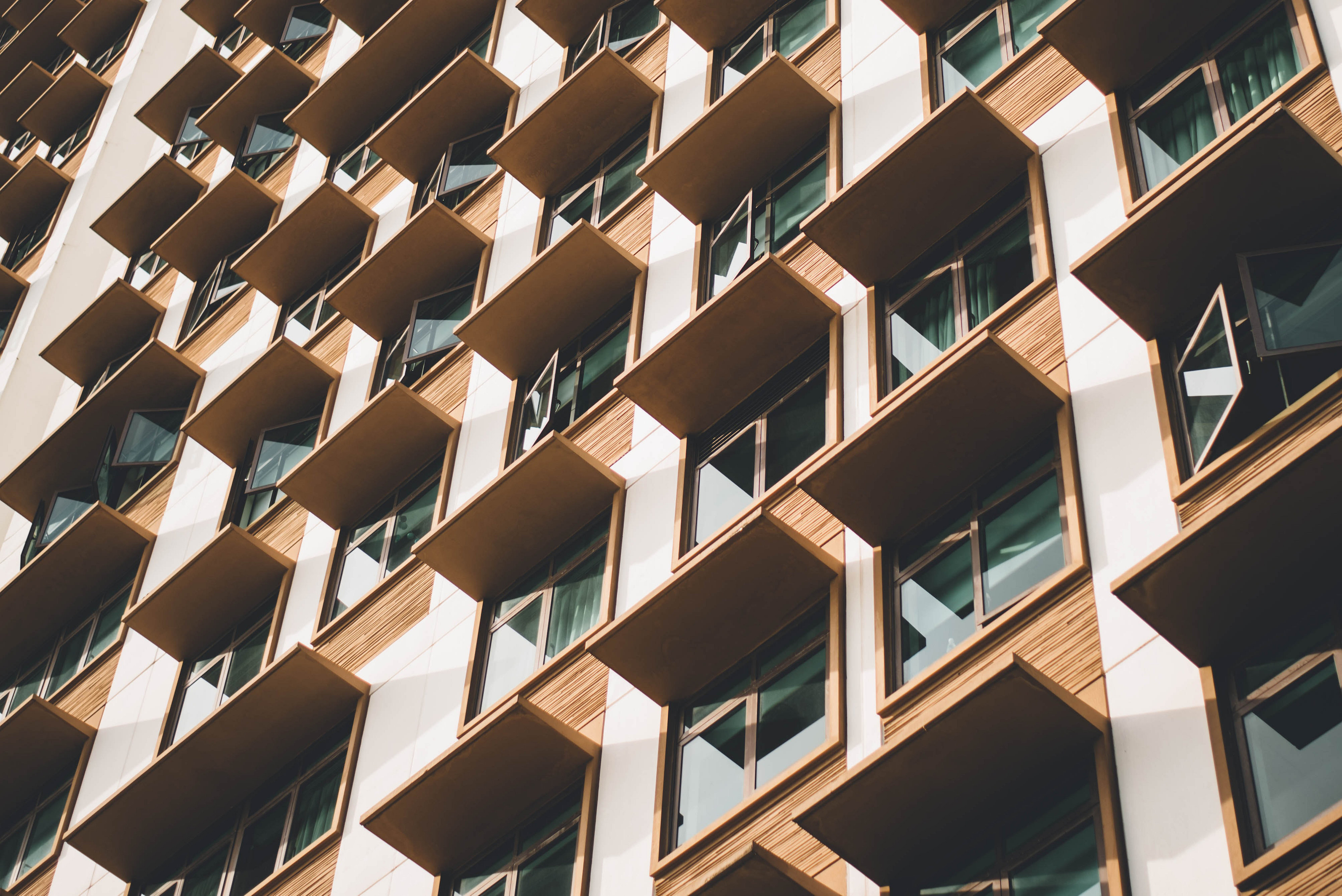 Building facade with shades over windows